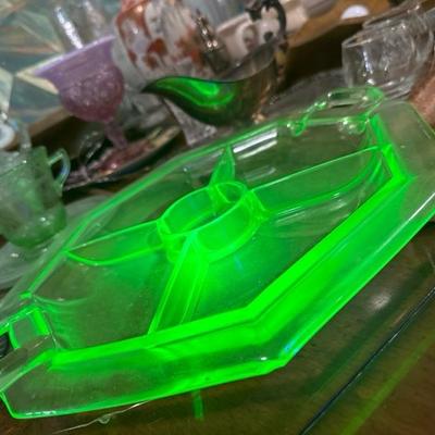 Sale Photo Thumbnail #825: This is a heavy uranium glass for compartment hors dâ€™oeuvre tray with a center area for a dipping sauce. It has one small nibble on the edge. Please see the photos otherwise great condition for an antique piece very heavy uranium. See photos for Ge