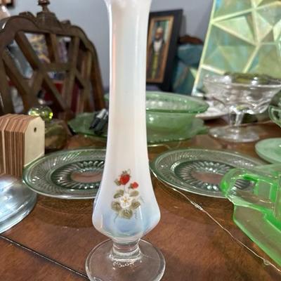 Sale Photo Thumbnail #832: This Fenton midcentury vintage hand painted white vase has a beautiful scalloped top and is designed to be a bud vase. It stands just shy of 8 inches tall and is signed on the bottom hand painted by Lisa W. There is a strawberry motif painted on front wit