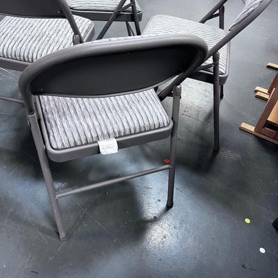 4 Folding Chairs with a padded seat 
