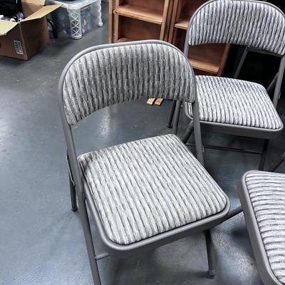 4 Folding Chairs with a padded seat 