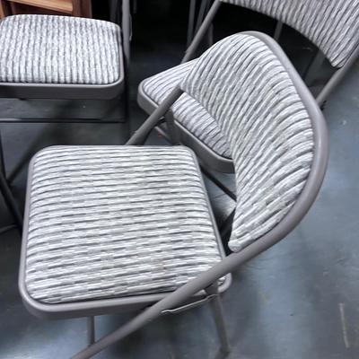 4 Folding Chairs with a padded seat 