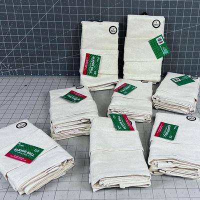 8 Packages of BISTRO NAPKINS Comes with a TOTE with Gold Thread. 32 total