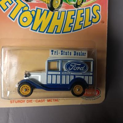 2 NIB 1955 CHEVROLET BEL AIR AND A FORD TRI-STATE DEALER WAGON TOYS