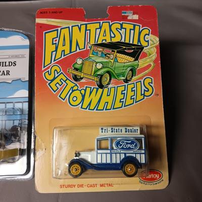 2 NIB 1955 CHEVROLET BEL AIR AND A FORD TRI-STATE DEALER WAGON TOYS