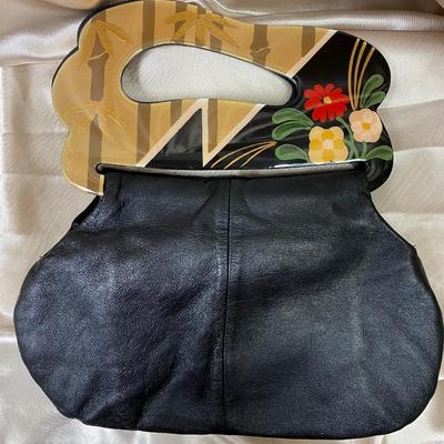Leather and plastic hand bag