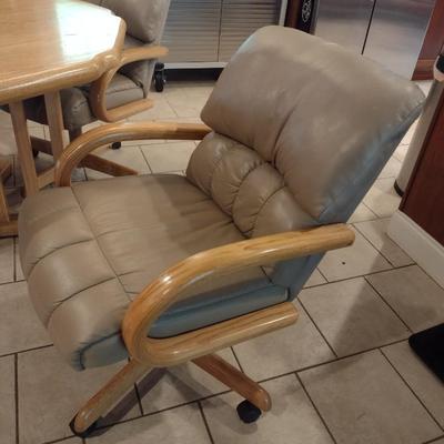 Solid Oak Octagonal Dining Table with Four Upholstered Rolling Chairs includes One Leaf Insert