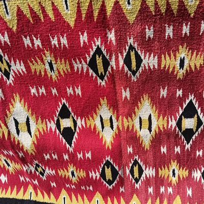 Colorful muti colored Native red rug appears handwoven.