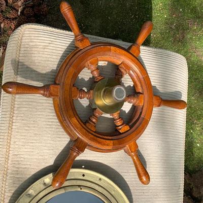 LOT 77: Nautical Decor with Wooden Ship's Wheel Brass Porthole Mirror and Brass Bell