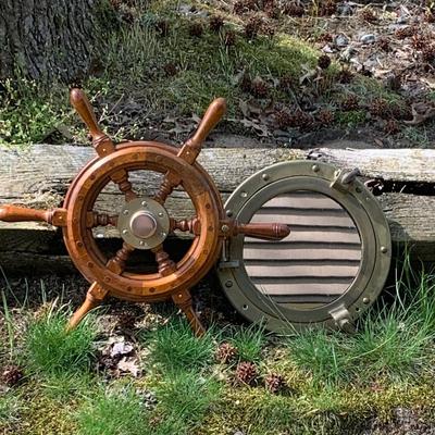 LOT 77: Nautical Decor with Wooden Ship's Wheel Brass Porthole Mirror and Brass Bell