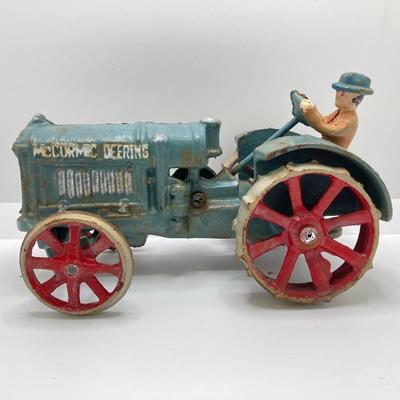 LOT 90: Cast Iron Toy Tractors - McCormic Deering and More