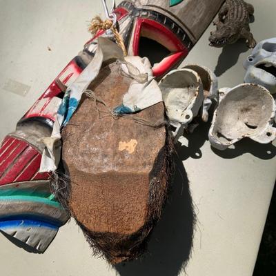 LOT 203: Wood Tiki Masks, Coconut Head Pirate, Cast Iron Skulls and Plastic Alligator