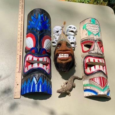 LOT 203: Wood Tiki Masks, Coconut Head Pirate, Cast Iron Skulls and Plastic Alligator