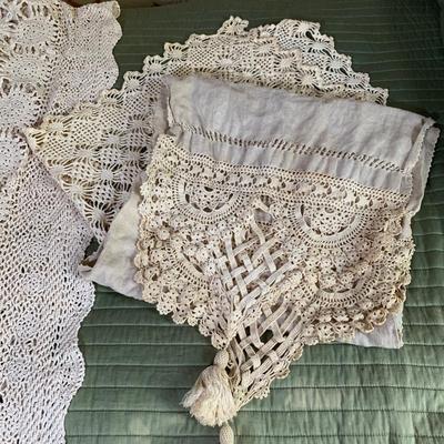 LOT 249: Crocheted Collection: Doilies & Tablecloth
