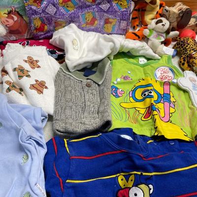 Baby clothes, books and Pooh items