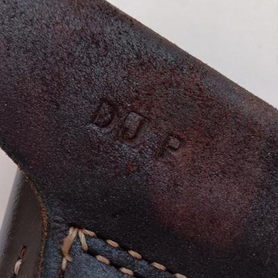 Leather pistol holster with leather magazine pouch