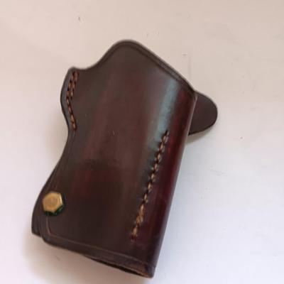Leather pistol holster with leather magazine pouch