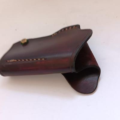 Leather pistol holster with leather magazine pouch
