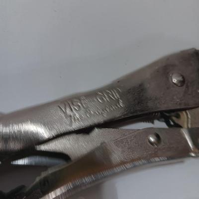 Variety of hand tools - Vise grips - pliers and an adjustable wrench