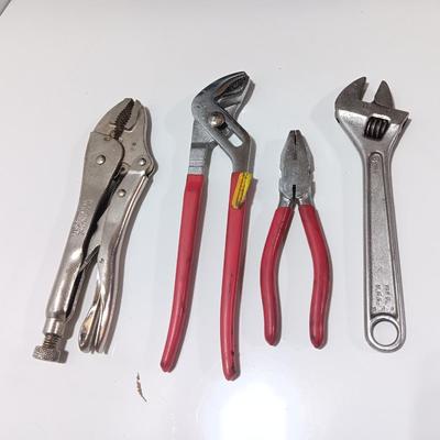 Variety of hand tools - Vise grips - pliers and an adjustable wrench