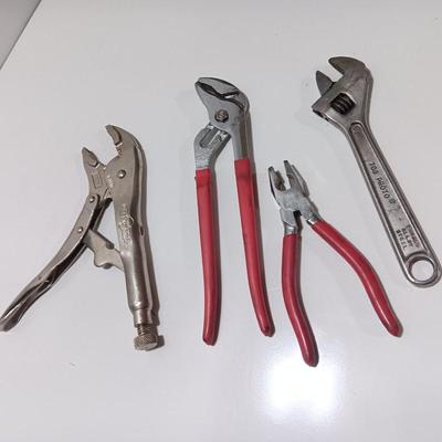 Variety of hand tools - Vise grips - pliers and an adjustable wrench