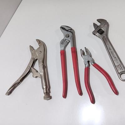 Variety of hand tools - Vise grips - pliers and an adjustable wrench