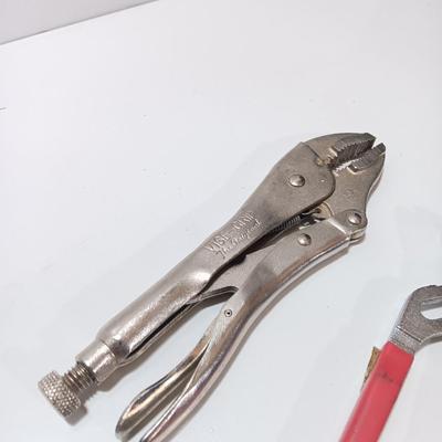 Variety of hand tools - Vise grips - pliers and an adjustable wrench