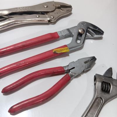 Variety of hand tools - Vise grips - pliers and an adjustable wrench