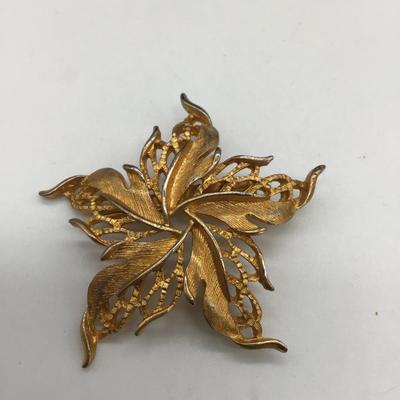 Gold toned leaf pin