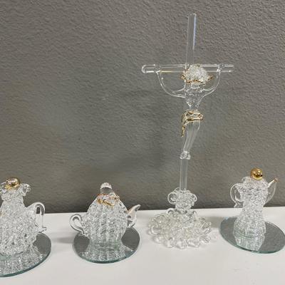 Hand blown spoon, glass, crucifix, and teapot