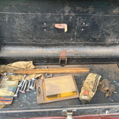Red and black metal toolbox with contents