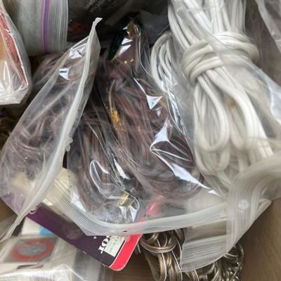 Box of electrical supplies, including outlets, surge protectors, and wire, etc