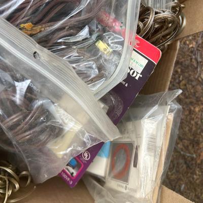 Box of electrical supplies, including outlets, surge protectors, and wire, etc