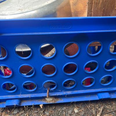 Blue plastic crate with various metal and glass lids, wooden box, etc.