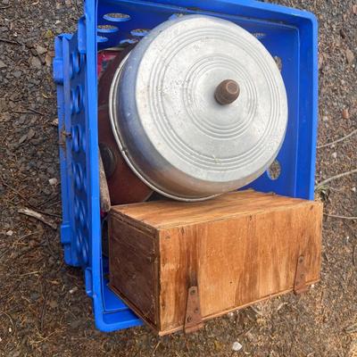 Blue plastic crate with various metal and glass lids, wooden box, etc.