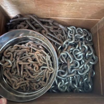 Wood box with various chains and metal tub