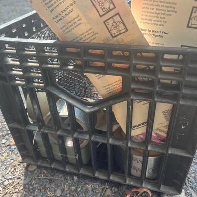Black plastic crate with light, clipboard, tools, etc