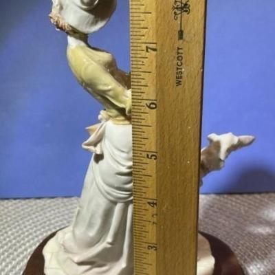 Vintage Arnart Pucci Porcelain Victorian Lady Walking Dog Figurine on Attached Wooden Base in VG Condition.