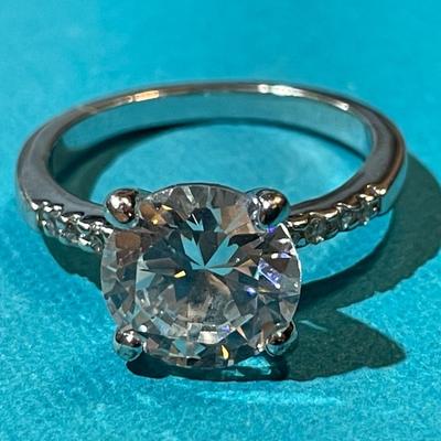 Vintage Silver-toned Fashion CZ Engagement Style Ring w/Center CZ Stone Measuring about 1.75 Carats in VG Preowned Condition.