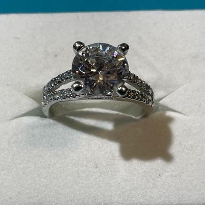 Vintage Silver-toned Fashion CZ Engagement Style Ring w/Center CZ Stone Measuring about 2-Carats in VG Preowned Condition.