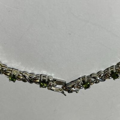 Vintage Estate .925 Sterling Silver Peridot Tennis Bracelet 7.5" Long in VG Preowned Condition as Pictured.