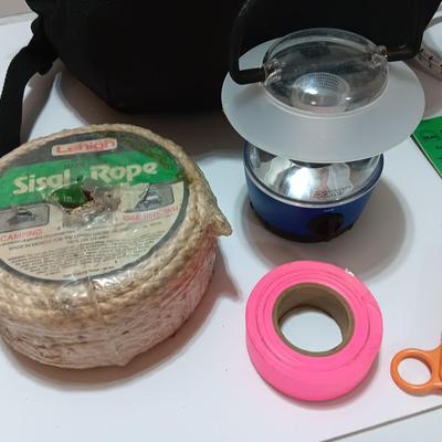 compass backpack with a variety of Bug out gear - decontamination kit - light - rope and more