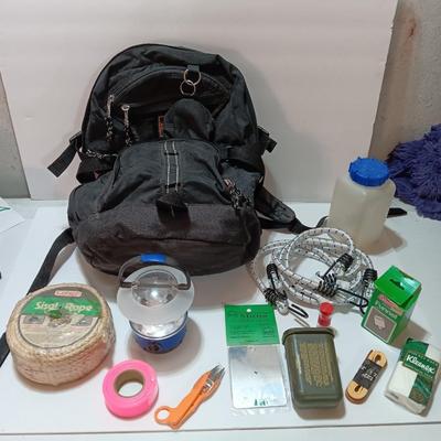 compass backpack with a variety of Bug out gear - decontamination kit - light - rope and more