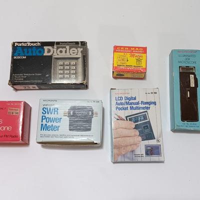 Assortment of new in the box vintage small electronics - Microphone - Multimeter - D.C. Motor - and more