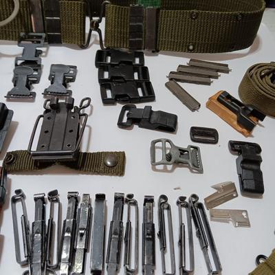 Large assortment of hooks and clips for military issued belts and tactical vests - knife sheaths - belt - canteen pieces.