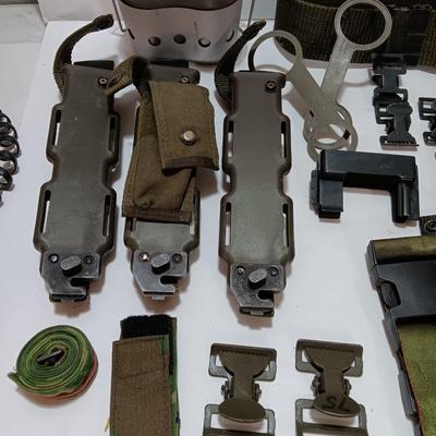 Large assortment of hooks and clips for military issued belts and tactical vests - knife sheaths - belt - canteen pieces.