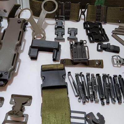 Large assortment of hooks and clips for military issued belts and tactical vests - knife sheaths - belt - canteen pieces.