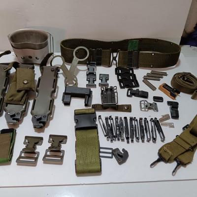 Large assortment of hooks and clips for military issued belts and tactical vests - knife sheaths - belt - canteen pieces.