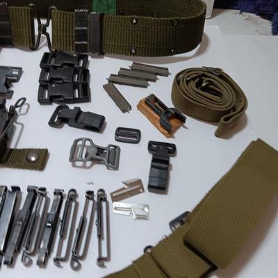 Large assortment of hooks and clips for military issued belts and tactical vests - knife sheaths - belt - canteen pieces.