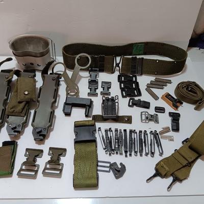 Large assortment of hooks and clips for military issued belts and tactical vests - knife sheaths - belt - canteen pieces.