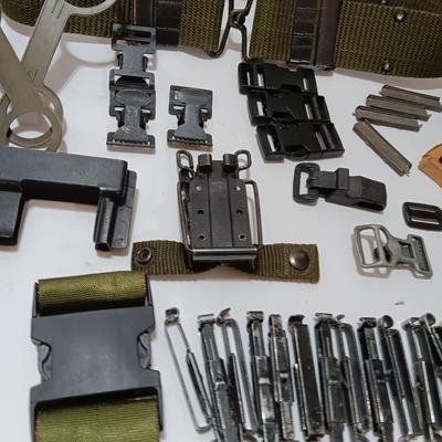 Large assortment of hooks and clips for military issued belts and tactical vests - knife sheaths - belt - canteen pieces.